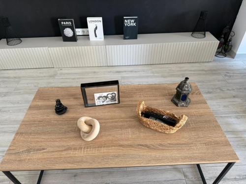 a coffee table with vases and other items on it at SuecaRoom in Sueca