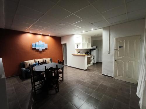 a kitchen and dining room with a table and chairs at Departamento La Morenita in Chilecito