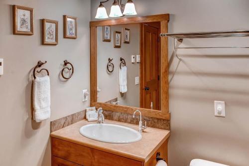 a bathroom with a sink and a mirror at Snowbanks 6 in Big White