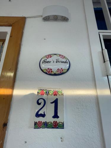 a white boat with a sign on the side of it at Rocco s Vivienda in Scalea