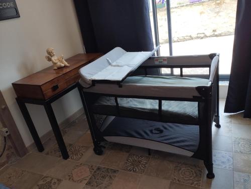 Ένα ή περισσότερα κρεβάτια σε δωμάτιο στο L'appartement Tranquille