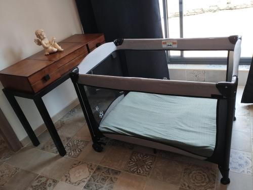 Ένα ή περισσότερα κρεβάτια σε δωμάτιο στο L'appartement Tranquille