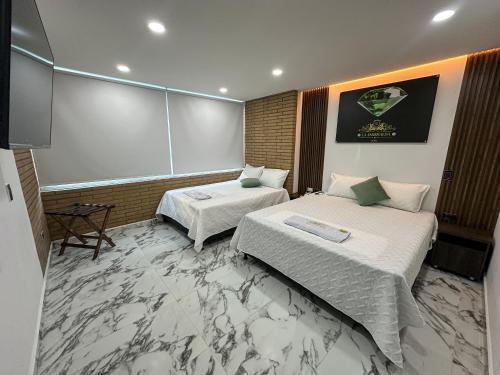 Postel nebo postele na pokoji v ubytování Hotel La Esmeralda Doradal