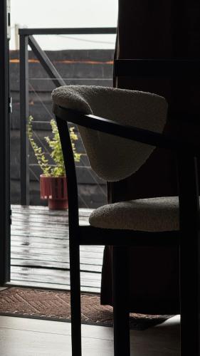 a chair sitting on top of a balcony at шАлАш in Velikiye Lazy