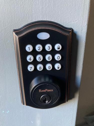 a black remote control attached to a wall at Modern North Conway Getaway in Conway