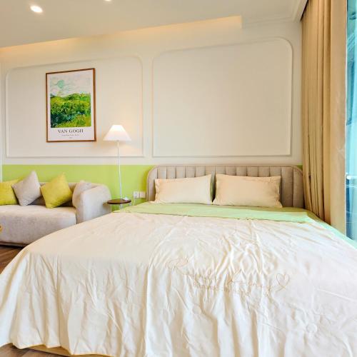a bedroom with a large bed and a couch at Swanlake ecopark Hanoi-Calm homestay in Kim Quan