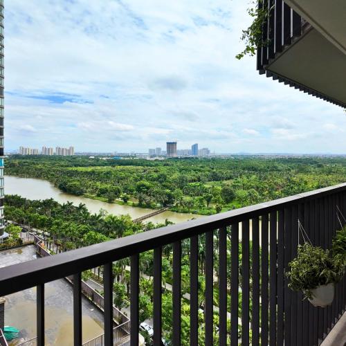 a view of a river from a balcony at Swanlake ecopark Hanoi-Calm homestay in Kim Quan