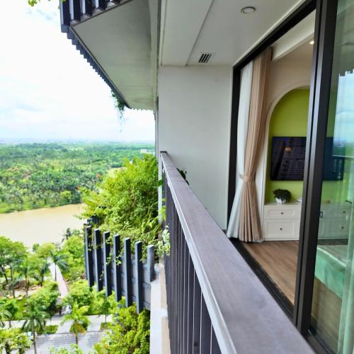a balcony with a view of the river at Swanlake ecopark Hanoi-Calm homestay in Kim Quan