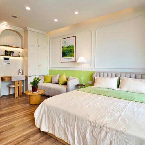 a bedroom with a bed and a couch at Swanlake ecopark Hanoi-Calm homestay in Kim Quan