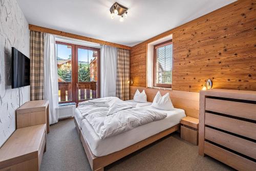 Кровать или кровати в номере Kukučka Lomnica - Tatranská Lomnica