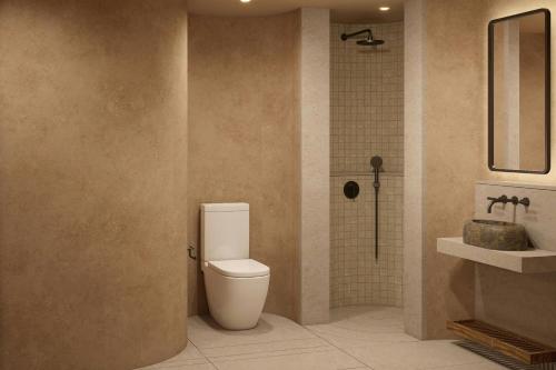 a bathroom with a toilet and a sink at Siari, a Ritz-Carlton Reserve 