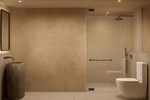 a bathroom with a shower and a toilet at Siari, a Ritz-Carlton Reserve 