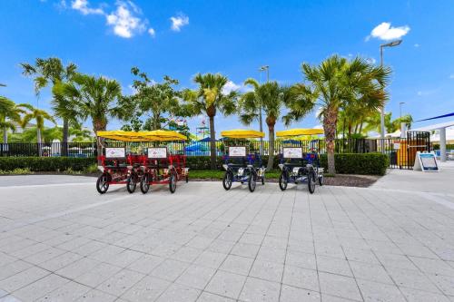 a group of four bikes parked in a parking lot at Grand Home Near Disney With Private Pool, Air Hockey Table And Waterpark & Resort Access At Encore Resorts Reunion - 401Sf in Kissimmee
