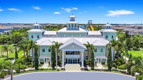 an aerial view of a large house with palm trees at Grand Home Near Disney With Private Pool, Air Hockey Table And Waterpark & Resort Access At Encore Resorts Reunion - 401Sf in Kissimmee