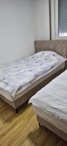 Postel nebo postele na pokoji v ubytování Apartman- Sarajevo
