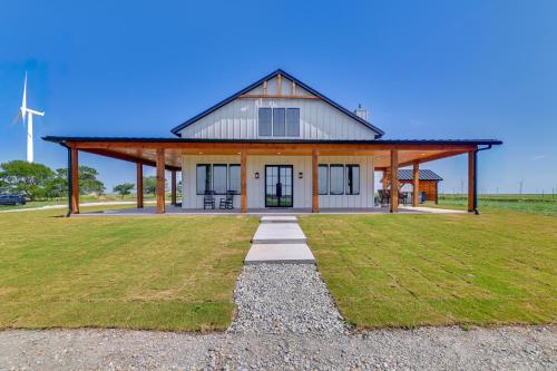 a large house with a gambrel roof at Rural Home with Hot Tub Less Than 7 Mi to Winery and Golfing in Muenster
