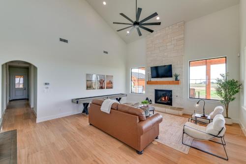 a living room with a couch and a fireplace at Rural Home with Hot Tub Less Than 7 Mi to Winery and Golfing in Muenster