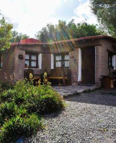 a small house with a porch and a door at Alta montaña 2 in Tilcara