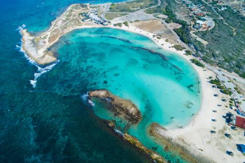 an aerial view of an island in the ocean at Aruba Sunrise Studio Near Baby Beach, San Nicolas in San Nicolas