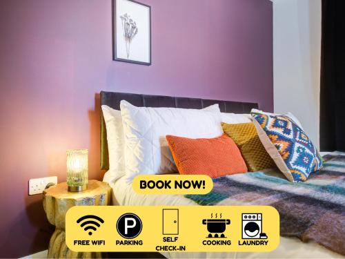 a bedroom with purple walls and a bed with pillows at 2bed 2bath In - Next To Station For 6 Free Parking in Ashford