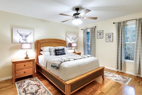 a bedroom with a bed and a ceiling fan at Deck and Game Room! Lakefront Blue Ridge Mtn Gem in Powderhorn Mountain