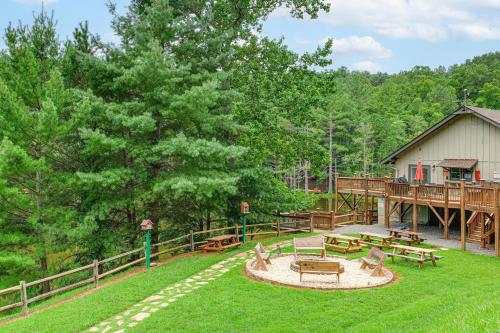 a yard with benches and a deck with a house at Deck and Game Room! Lakefront Blue Ridge Mtn Gem in Powderhorn Mountain
