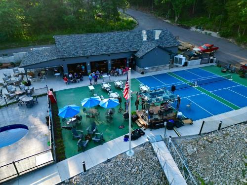 an aerial view of a tennis court with a tennis court at Pebble Bay Club Suites in Camdenton