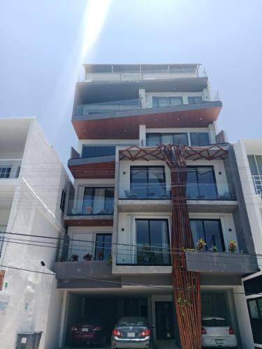 a tall building with a ribbon hanging from it at Turix 102 in Puerto Morelos