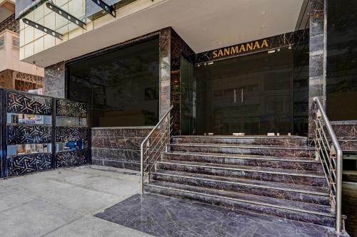a set of stairs in front of a building at Super Townhouse OAK Clove Boutique Hotel Rajaji Nagar Near Lulu Mall Bengaluru in Bengaluru