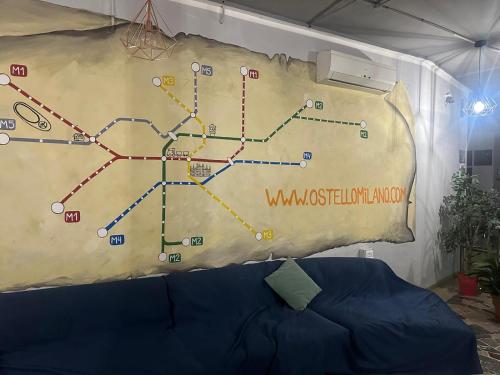 a wall with a map of aondon underground map at Hi! Ostello Milano in Milan