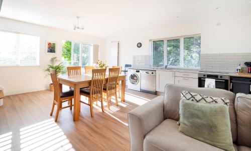 a kitchen and living room with a table and chairs at 1 bedroom Apartment Ballaghderg Letterkenny in Letterkenny