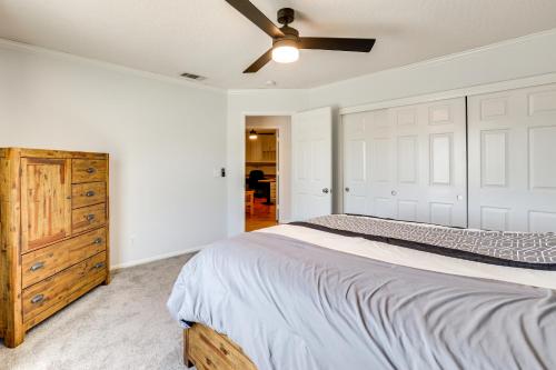 a bedroom with a bed and a ceiling fan at Pool, Spa and Mountain Views Apple Valley Retreat! in Apple Valley