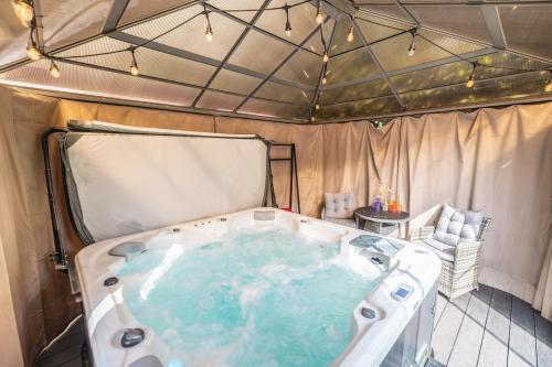 a hot tub in a tent with at Hot Tub and Garden Spacious Unique 3 Bed House in Allesley