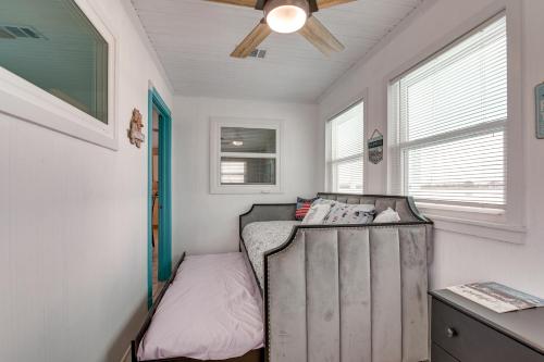 a bedroom with a bed and a ceiling fan at Private Bayfront Access 10 Mi to Galveston Beaches in Hitchcock