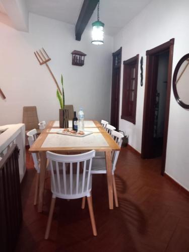a wooden table and chairs in a room at Canarian House with views and pool in Los Realejos