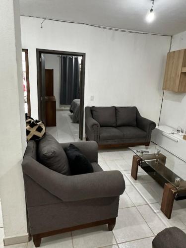 a living room with a couch and a table at Casa muy cómoda de 2 pisos en zona muy tranquila in Media Fanega