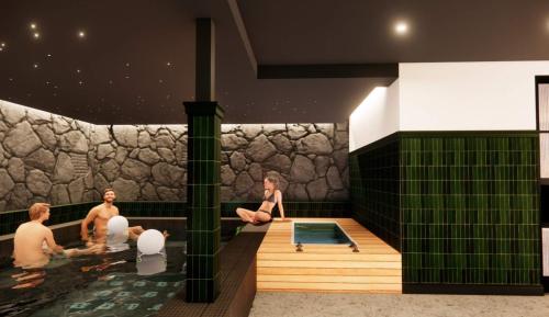 a group of people sitting in a hot tub at Lightwell Hotel & Spa in Hood River