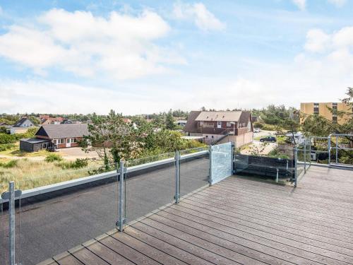 a balcony with a view of a city at 4 star holiday home in Nørre Nebel in Nørre Nebel