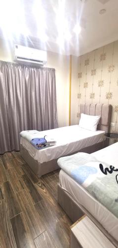 aladdin hotel Egypt Badrにあるベッド