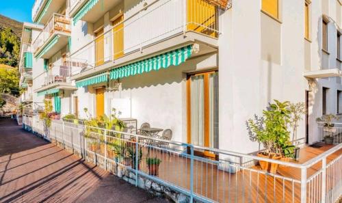 a balcony of a building with plants on it at Oasi Relax Alassio Riviera in Alassio