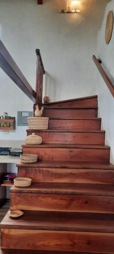 a set of wooden stairs in a house at El Mango - rural house with fast internet in San Cristobal