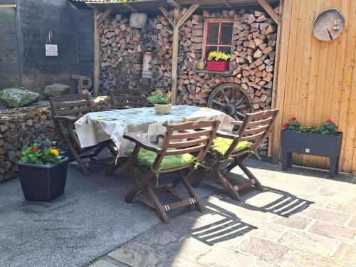 a table and chairs sitting on a patio at Apartment Katharina in Steinach am Brenner