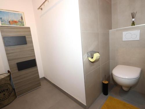 a small bathroom with a toilet and a sink at Apartment Katharina in Steinach am Brenner
