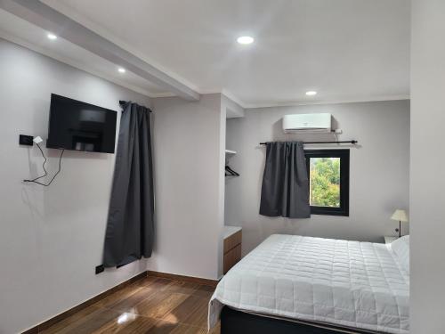 Ένα ή περισσότερα κρεβάτια σε δωμάτιο στο FDH Apart