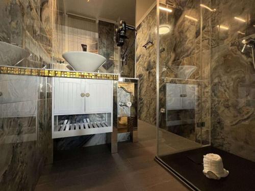 a bathroom with a sink and a shower at Luxury of togetherness in Zirkitz