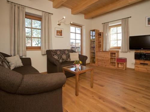 a living room with a couch and a table at Holiday home in the vineyard The Vineyard in Fehring