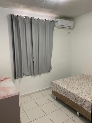 En eller flere senge i et værelse på Condomínio Ideal Br - COP 30