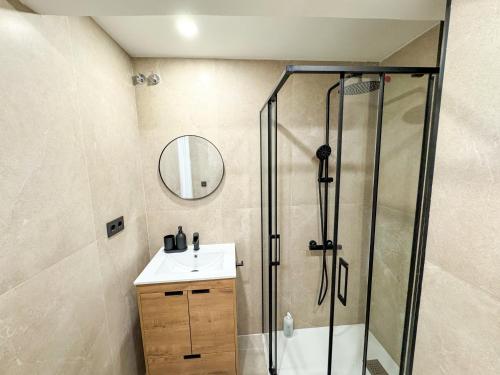 a bathroom with a shower and a sink at El Rinconín - Tu Casa En Gijón in Gijón