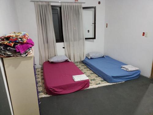 Llit o llits en una habitació de La casa de abi