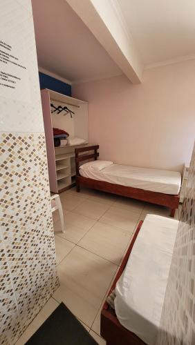 Katil atau katil-katil dalam bilik di Hostel Seu Juca - ambiente acolhedor, durma em paz!